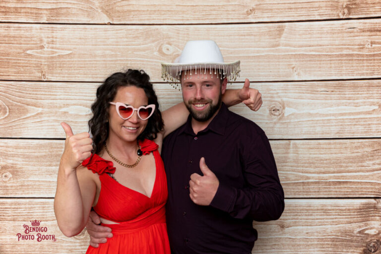 Guests having a blast at a Shepparton wedding with a timber background