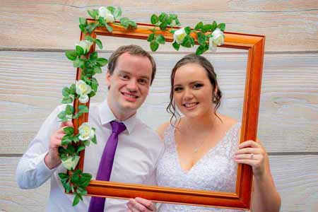 Group of guests laughing and taking photos in the Shepparton Photo Booth.